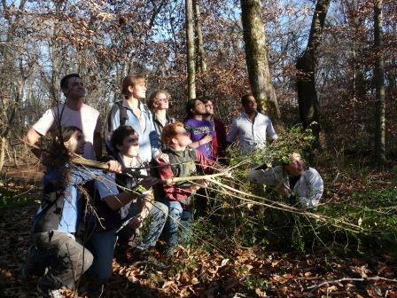 Sewanee's Bio 315 class in "gaze at the sun as if something inspiring and important was happening" pose after pulling 4275 privet stems. The largest vanquished stem is held as a trophy. We omitted the blooding ceremony.